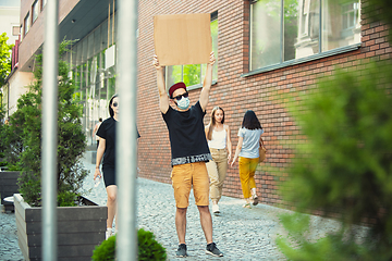 Image showing Dude with sign - man stands protesting things that annoy him