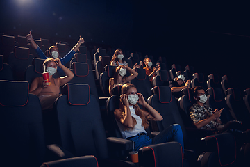 Image showing Cinema, movie theatre during quarantine. Coronavirus pandemic safety rules, social distance during movie watching