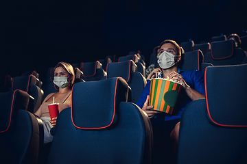 Image showing Cinema, movie theatre during quarantine. Coronavirus pandemic safety rules, social distance during movie watching