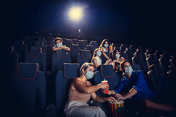 Image showing Cinema, movie theatre during quarantine. Coronavirus pandemic safety rules, social distance during movie watching