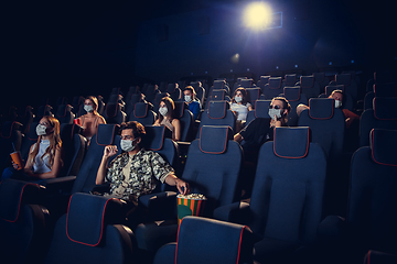 Image showing Cinema, movie theatre during quarantine. Coronavirus pandemic safety rules, social distance during movie watching