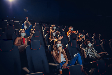 Image showing Cinema, movie theatre during quarantine. Coronavirus pandemic safety rules, social distance during movie watching