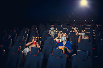 Image showing Cinema, movie theatre during quarantine. Coronavirus pandemic safety rules, social distance during movie watching