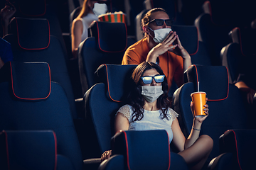 Image showing Cinema, movie theatre during quarantine. Coronavirus pandemic safety rules, social distance during movie watching