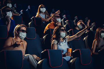 Image showing Cinema, movie theatre during quarantine. Coronavirus pandemic safety rules, social distance during movie watching