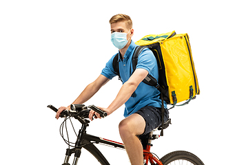 Image showing Deliveryman isolated on white studio background. Contacless delivery service during quarantine.