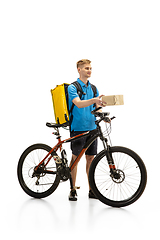 Image showing Deliveryman isolated on white studio background. Contacless delivery service during quarantine.