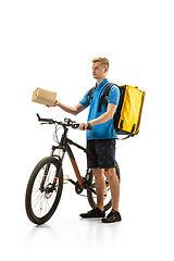 Image showing Deliveryman isolated on white studio background. Contacless delivery service during quarantine.