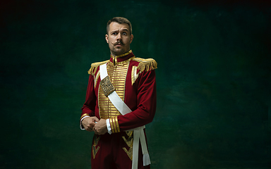 Image showing Young man as Nicholas II on dark green background. Retro style, comparison of eras concept.