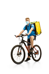 Image showing Deliveryman isolated on white studio background. Contacless delivery service during quarantine.