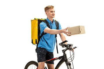 Image showing Deliveryman isolated on white studio background. Contacless delivery service during quarantine.