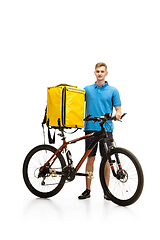 Image showing Deliveryman isolated on white studio background. Contacless delivery service during quarantine.
