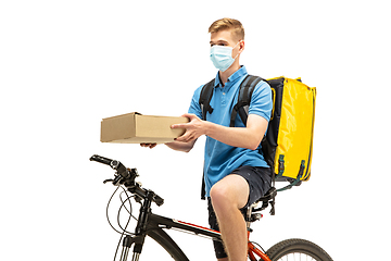 Image showing Deliveryman isolated on white studio background. Contacless delivery service during quarantine.