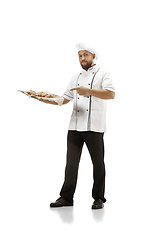 Image showing Cooker, chef, baker in uniform isolated on white background, gourmet.