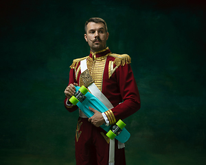 Image showing Young man as Nicholas II on dark green background. Retro style, comparison of eras concept.