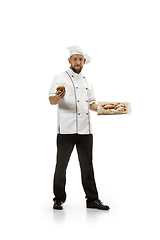 Image showing Cooker, chef, baker in uniform isolated on white background, gourmet.