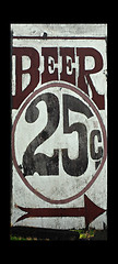 Image showing An old weather beaten sign advertising 25 cent beer