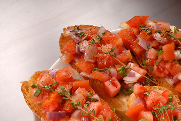 Image showing Tomato and onion bruschetta with thyme