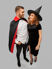 Image showing couple in halloween costumes of witch and vampire