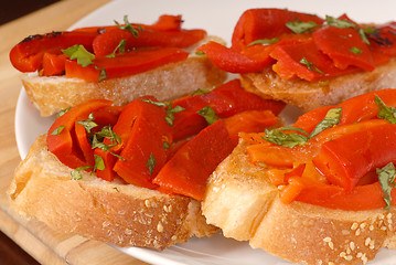 Image showing Roasted red pepper and basil bruschetta on a white plate