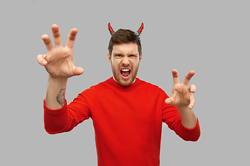 Image showing man in halloween costume of devil scaring