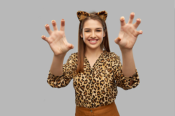 Image showing happy woman in halloween costume of leopard