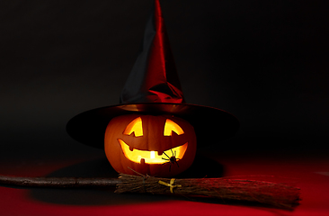 Image showing halloween jack-o-lantern in witch's hat and broom