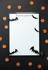 Image showing clipboard and halloween party decorations