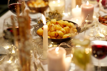 Image showing baked potato on served table at home dinner party