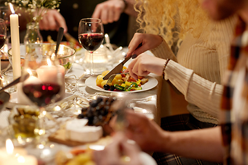 Image showing group of friends having christmas dinner at home