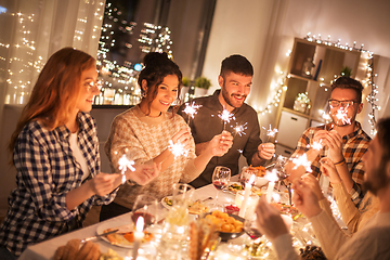 Image showing happy friends having christmas dinner at home