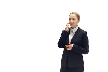 Image showing Young woman, accountant, booker in office suit isolated on white studio background