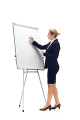 Image showing Young woman, accountant, booker in office suit isolated on white studio background