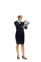 Image showing Young woman, accountant, booker in office suit isolated on white studio background