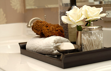 Image showing Several toiletries and bath items on bathroom vanity