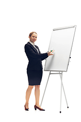 Image showing Young woman, accountant, booker in office suit isolated on white studio background