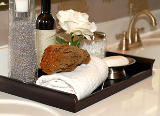 Image showing Towels, soap, sponges and bathoil on vanity