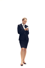 Image showing Young woman, accountant, booker in office suit isolated on white studio background