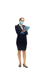 Image showing Young woman, accountant, booker in office suit isolated on white studio background