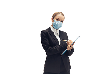 Image showing Young woman, accountant, booker in office suit isolated on white studio background