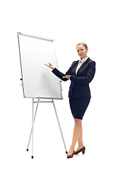 Image showing Young woman, accountant, booker in office suit isolated on white studio background