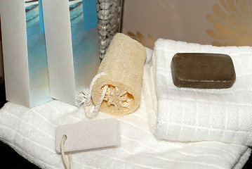 Image showing Towels, soap and sponges on bathroom vanity