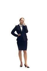 Image showing Young woman, accountant, booker in office suit isolated on white studio background