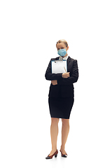 Image showing Young woman, accountant, booker in office suit isolated on white studio background