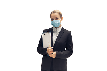 Image showing Young woman, accountant, booker in office suit isolated on white studio background