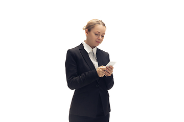 Image showing Young woman, accountant, booker in office suit isolated on white studio background