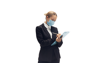 Image showing Young woman, accountant, booker in office suit isolated on white studio background