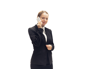 Image showing Young woman, accountant, booker in office suit isolated on white studio background