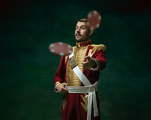 Image showing Young man as Nicholas II on dark green background. Retro style, comparison of eras concept.