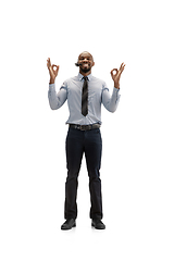 Image showing Young african-american call center consultant with headset isolated on white studio background